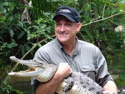Brady Barr holding a small crocodile
